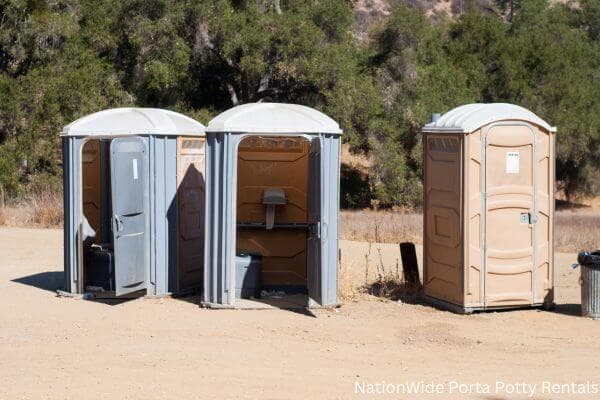 a clean row of portable restrooms for outdoor weddings or festivals in Lewistown, MT